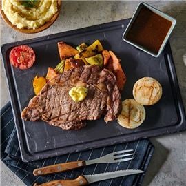 Rib eye steak with steamed vegetables and mashed potato